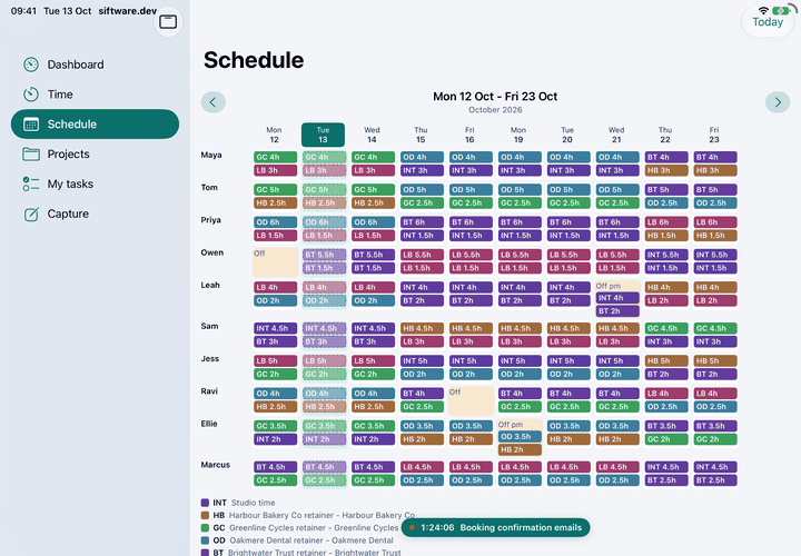 The schedule on a landscape iPad, with the app's sidebar open: ten team members down the side, two working weeks across, each day booked to client retainers or marked as time off.